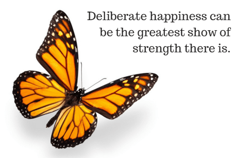 Deliberate happiness can be the greatest show of strength there is